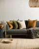 Four earthy-toned Baya Flaxmill linen cushions on a contrast couch