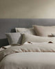 Modern home bed setting featuring cushion and bedding by Weave Home nz