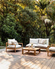 A stylish, modern outdoor, deck seatied area featuring the brown Lonsdale outdoor rug by Baya