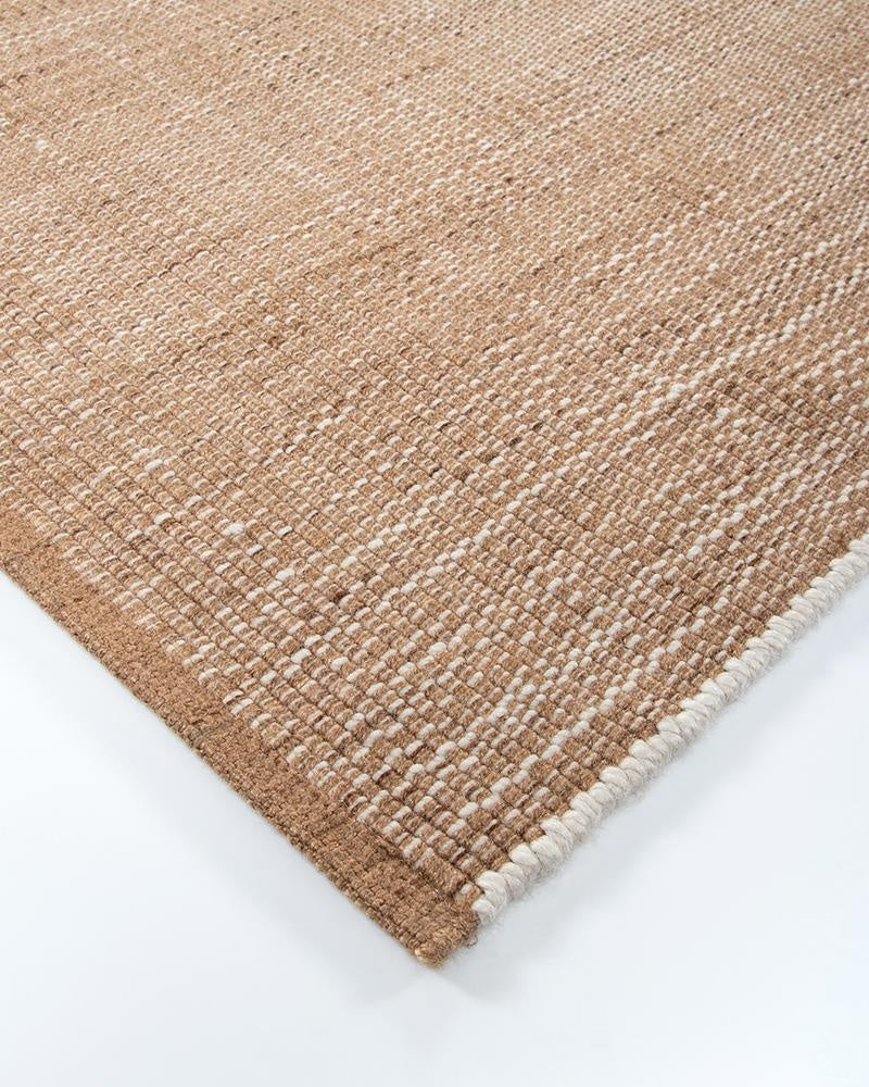 Close up of a corner of the Lonsdale outdoor rug by Baya, showing the white and brown weave