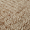 Close up of the Tepih Lunan wool and jute blend floor rug in a cream and umber colour