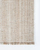 The fringe detail and the cream and brown weave of the Rhodes outdoor runner rug