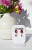 Hangen + Co maroon dangle earrings with gold findings, and glass and pearl charms