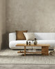 The Baya Alder Oat cushions on a couch in minimalist living room.