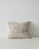 A woven cushion in creamy white, taupe and warm earthy tones - the Tripoli Fog by Weave Home nz.