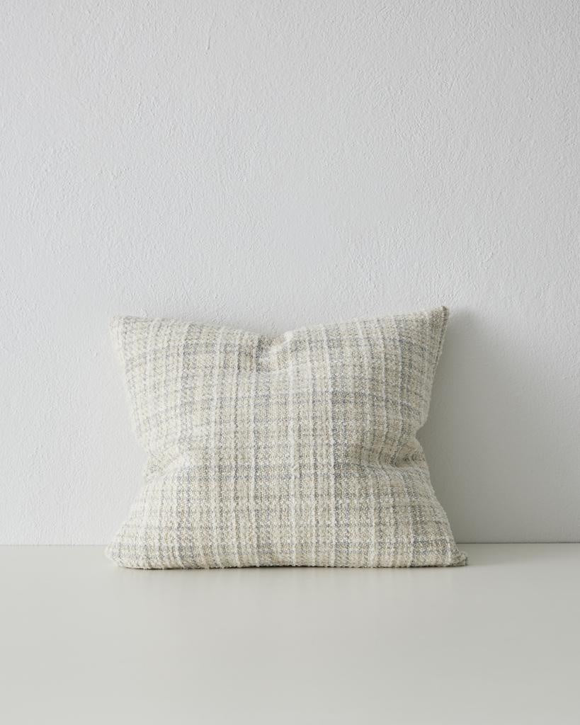 A beautiful woven cushion in white, alongside subtle beige and blue - the Tripoli Pearl