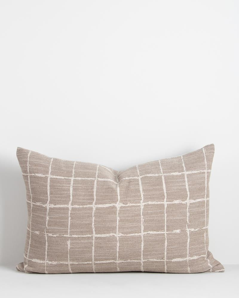 A taupe coloured lumbar cushion featuring a grid design in white in a hand-painted style inspired by Japanese design. The Johnson Taupe by Baya.