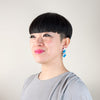 Model wearing silver and blue acrylic designer earrings by Mystic Forms UK