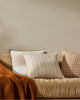 Three designer cushions, in warm tones, that pair well together , all by Weave nz