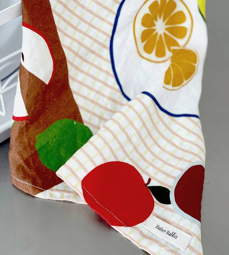 Close up of Father Rabbit tea towel with the cheery Fruit on Plates design