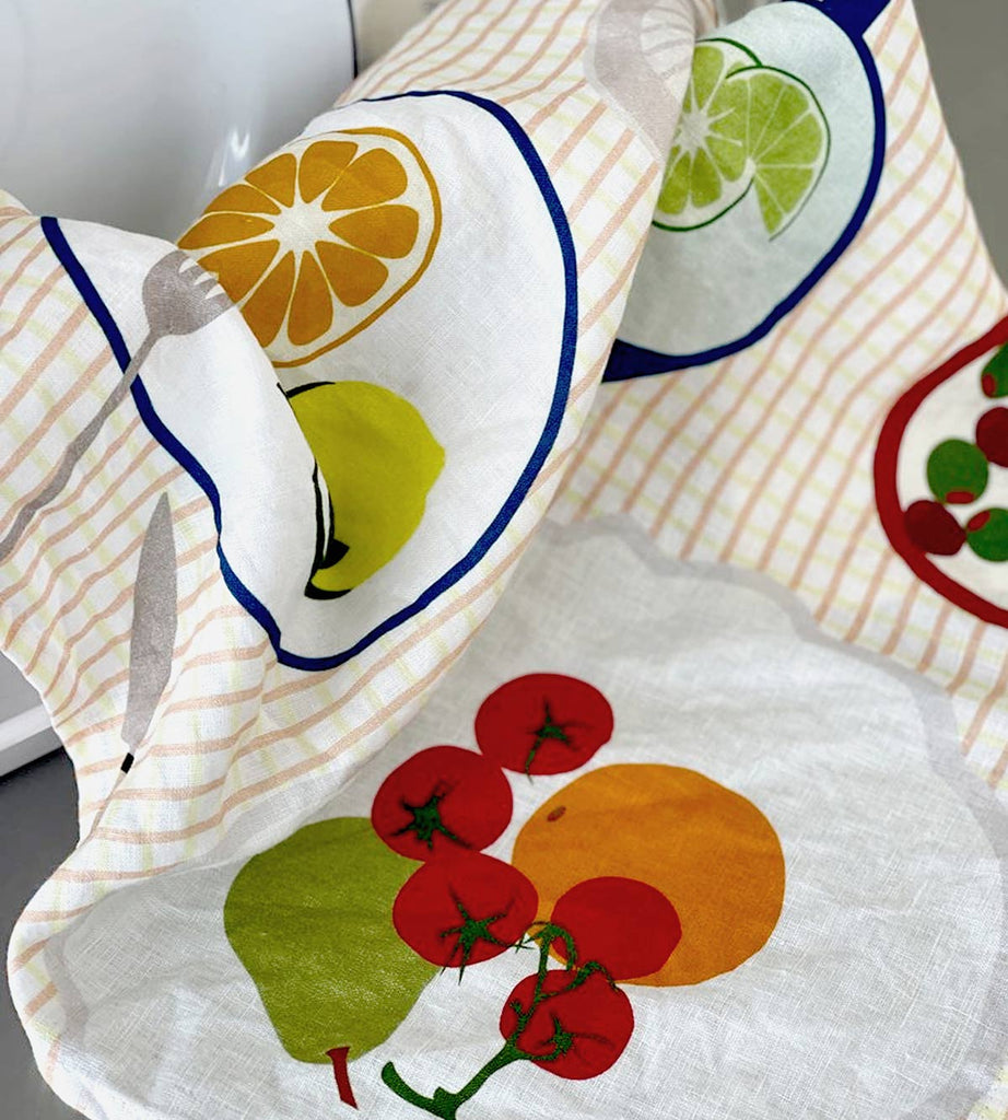 Close up of Father Rabbit tea towel with the cheery Fruit on Plates design, bringing light and brightness to the kitchen