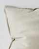 A close up of the flange edge of the Fiore Cushion in colour 'Pigeon' - a pale grey-white