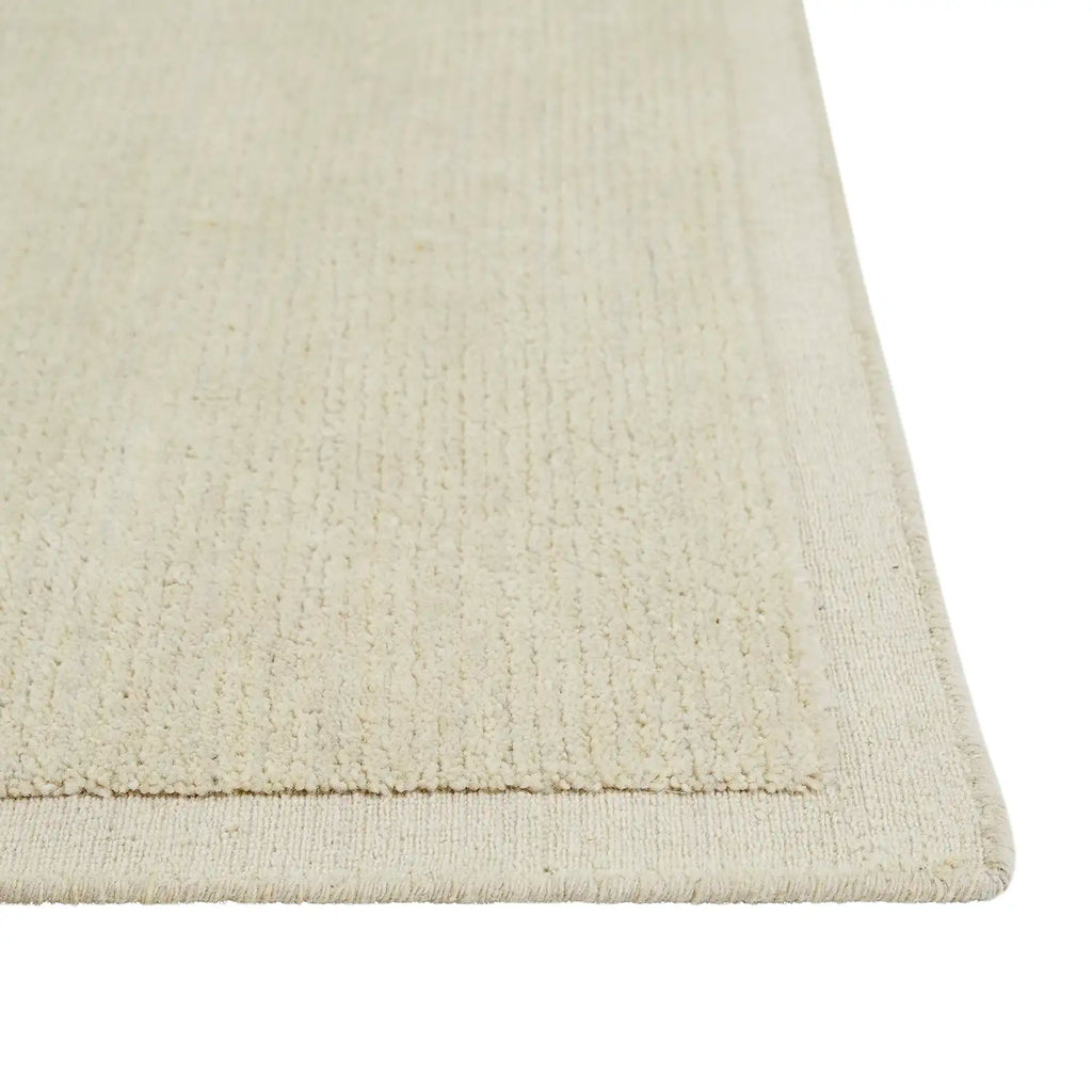 Close up of the contrast woven frame detail in the 100% wool Bower Frame floor rug