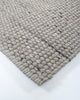 Close up corner view of the grey Pelorus outdoor runner rug by Baya