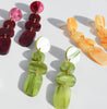 NZ designer Hagen + Co's marbled acrylic dangle earrings in green, merlot and sunset orange.