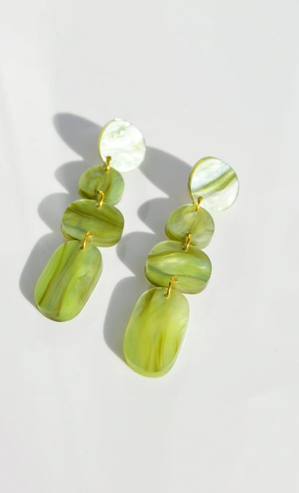 Hagen + Co's marbled-green acrylic dangle earrings featuring four organic shapes