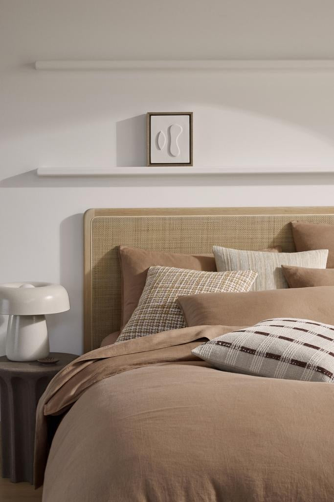 Bedding and cushions in a stylish bedroom, by Weave Home nz