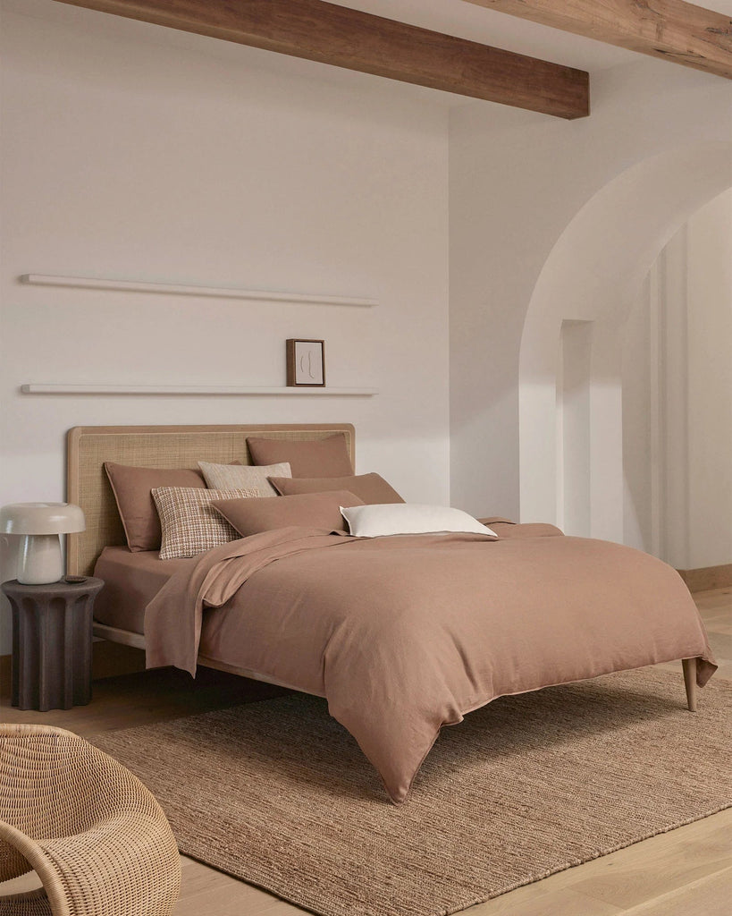 A clam and sophisticated bedroom in warm on-trend colours, featuring home decor by Weave nz