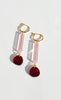 An elegant pink, burgundy and gold pair of dangle earrings by NZ designer Hagen + Co