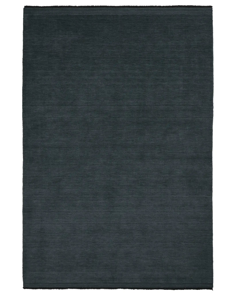 The Weave Home Silvio Rug in colour dusk, seen from above - a deep muted blue