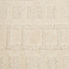 A creamy white wool-blend floor rug featuring an abstract horizontal pattern