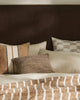 A stylish bedroom setting featuring brown-toned cushions by Weave Home nz