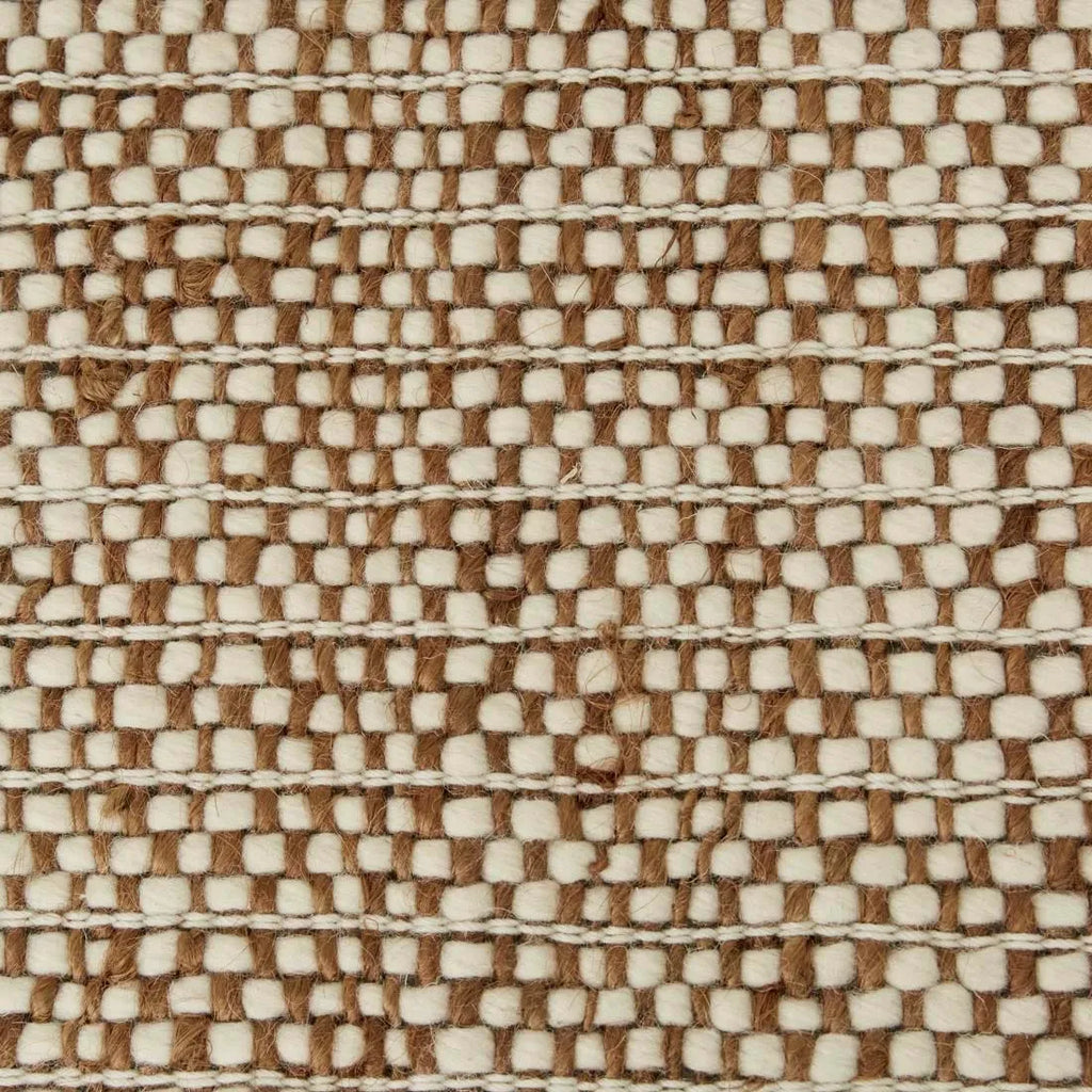 Close up of the Tepih Lunan wool and jute blend floor rug in a cream and umber colour