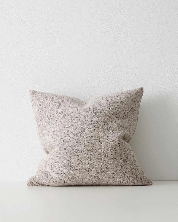 A textured taupe mushroom toned cushion. 
