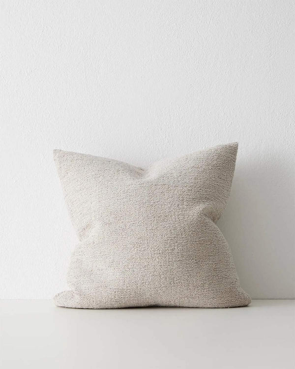 A cool toned off-white cushion with a soft subtle texture in the weave. 