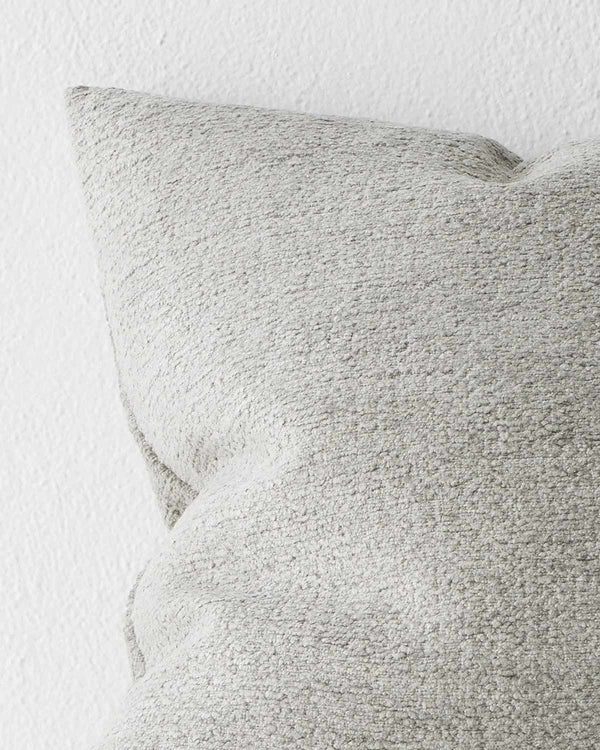 A close up image of a light grey textural cushion.