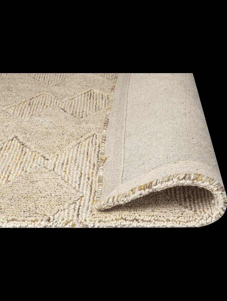 The Tribe Home Manhattan NZ wool floor rug, shown with the edge folded up to reveal the underneath