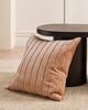 A striped velvet textural cushion in shades of warm, muted clay pink, by Baya. 