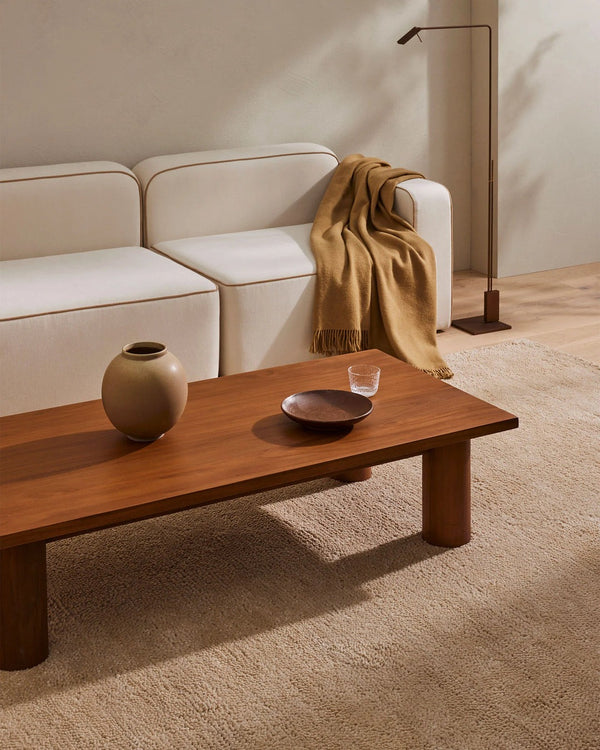 A pale, milky-brown coloured wool rug with a thick, plush pile - the Valencia Dune by Weave Home - seen in a modern, minimalist living room.