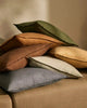 Stack of luxurious, earthy toned,Weave cushions fromt he Fiore range, a linen chenille blend