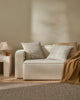 Puglia foor rug and Tripoli cushions in warm neutral colours, by Weave Home nz, seen in a light, modern home