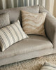 The Weave Home Vinnie lumbar striped cushion seen next to other neutral modern cushions