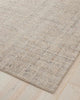 A cool beige toned textural floor rug with a very subtle pattern in darker tones, with loop piling. 
