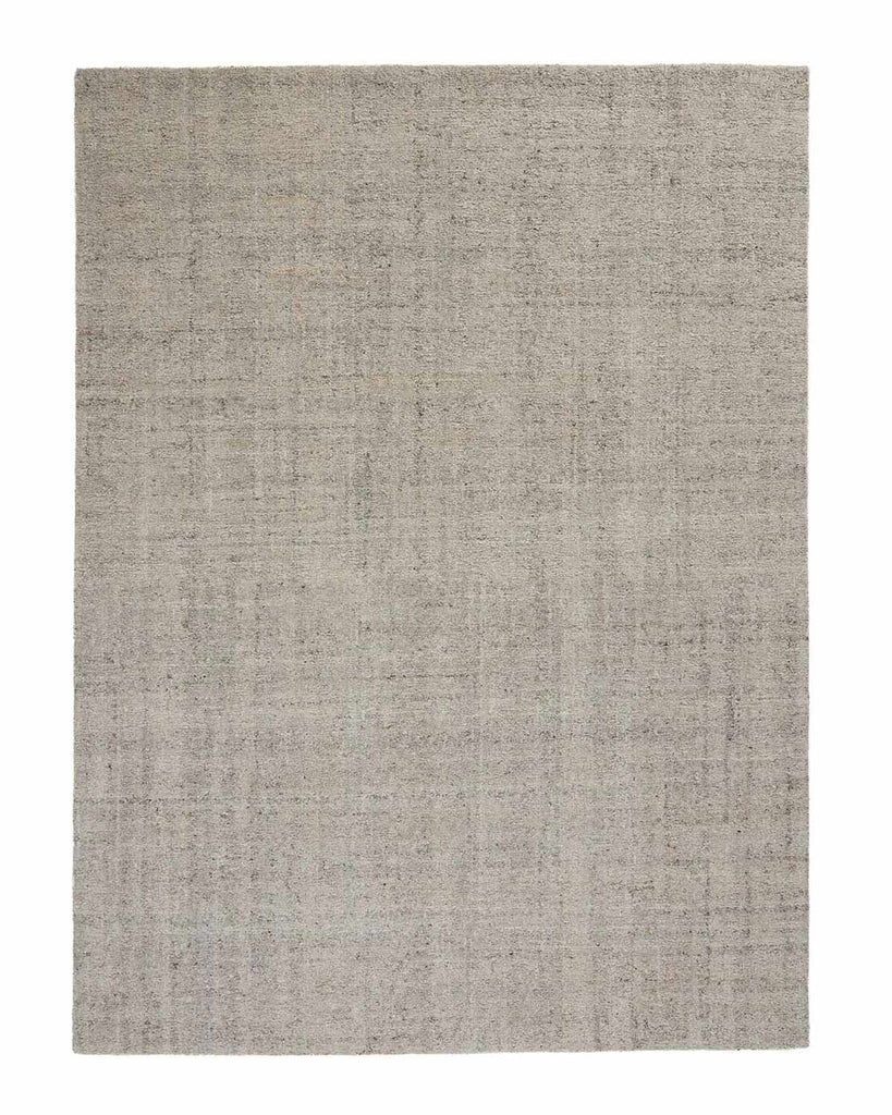 A full image of a textural loop pile floor rug in cool taupe tones with slight grid-like patterning in the weave. 