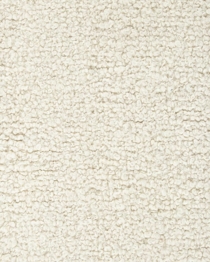 Extreme close up of the Dorset, boucle weave wool and merino floor rug by Baya in a natural white 