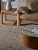 Large wool and jute blend floor rug in a cream and umber colour, in a stylish living room