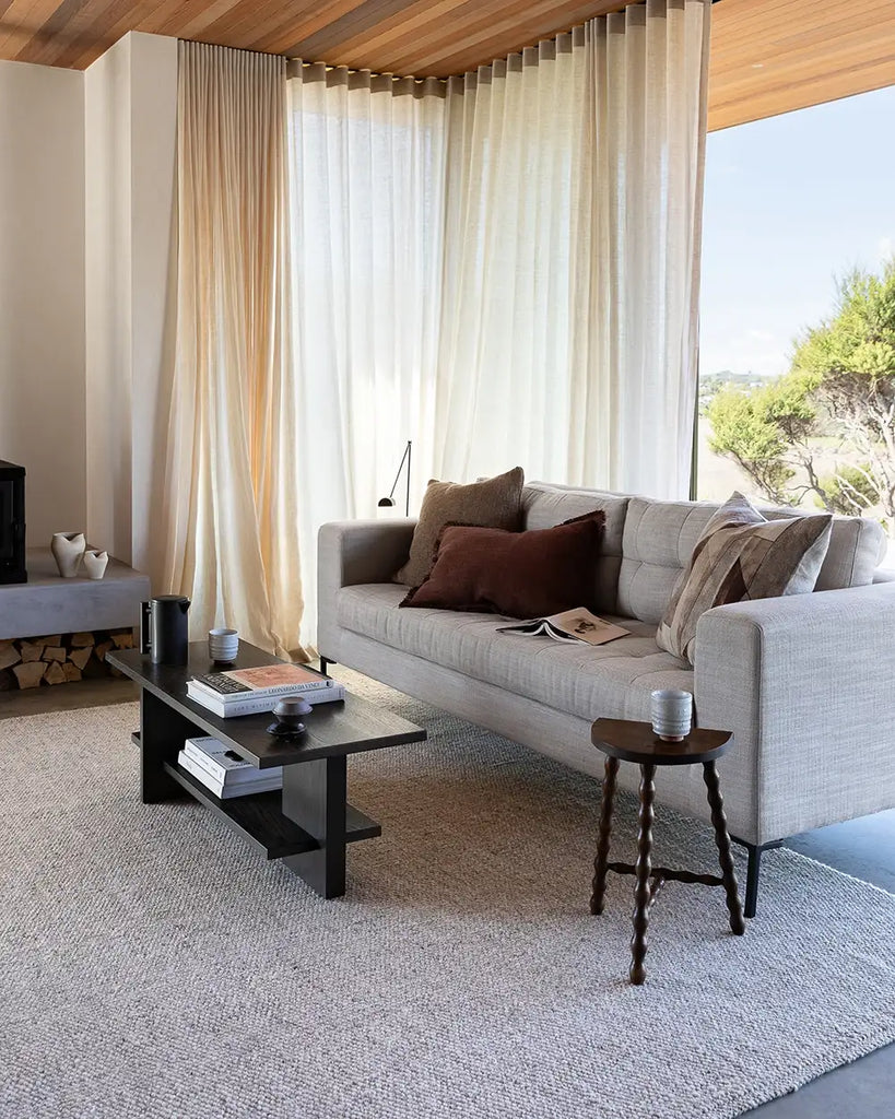 The Baya woven textural floor rug 'Omaha' in colour 'Pebble' seen in a modern home