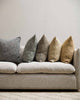 Five of the Cumbria range of cushions styled on a couch, bringing texture and style to the room. By Baya