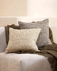 Two textured cushions in the Cumbria range by Baya. One in the shade Oak, one in the shade Pebble. The brown and cream texturality work brilliantly with the brown throw and cream armchair. 
