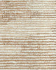 A detailed image of the weave of the Beckett floor rug by Baya, showing the different tones of beige, cream, and light brown, and loop styles, giving insight to how the pattern comes together. 