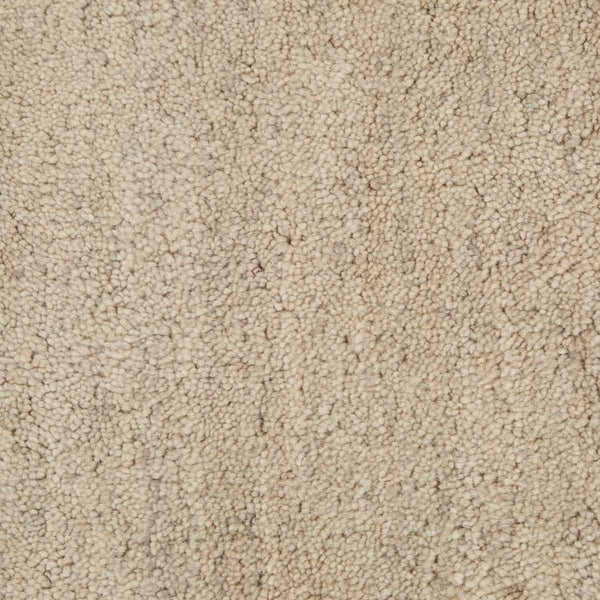 Close up of a soft handloomed rug in a soft beige Pumice colour by Soren Liv