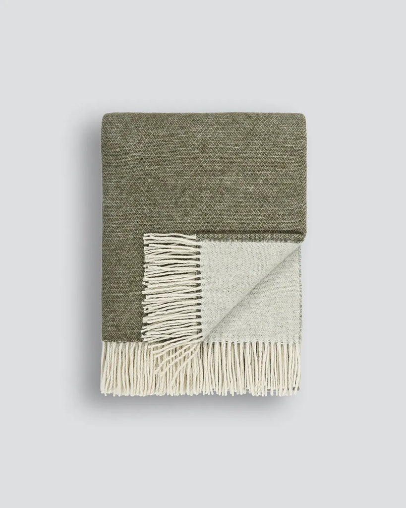 Merino wool-blend throw blanket by Baya in an olive green