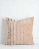 A soft velvety textural cushion with stripes in shades of soft creamy pink and beige. By Baya
