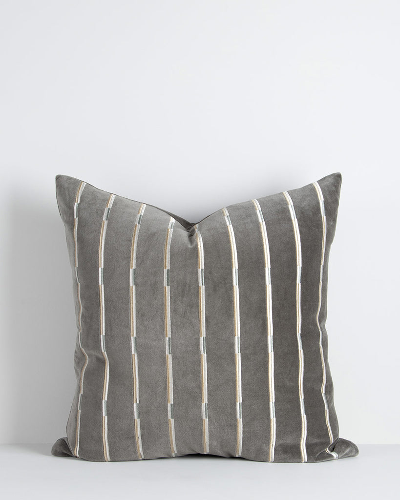 A soft velvety textural cushion with stripes in shades of slate and sage. By Baya