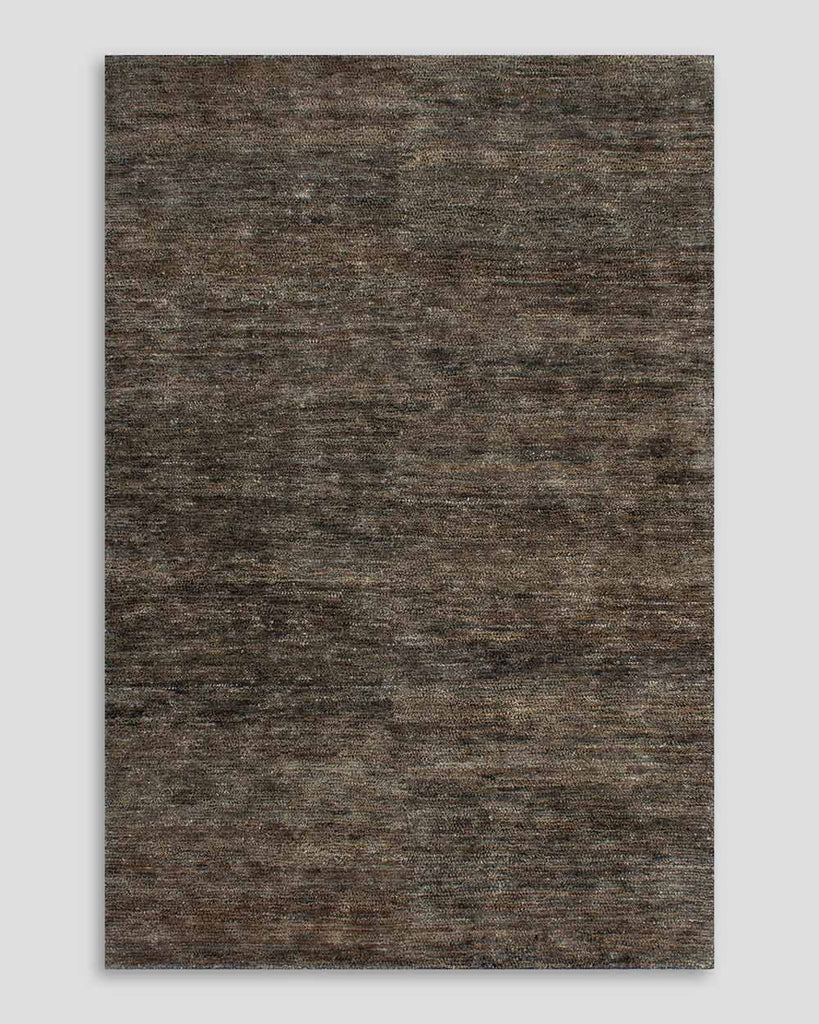 A full image of the Fairbanks floor rug, an effortlessly luxurious bamboo silk and jute blend. The warm brown of the jute blends with the soft greys of the silk in a beautiful medley.