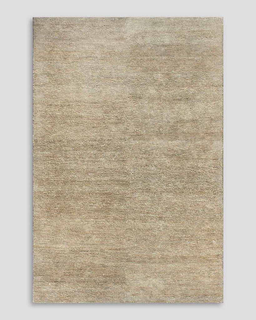 A full image of the Baya Fairbanks floor rug in Limestone, a soft beige. The jute and bamboo silk fibres shift the tones marginally, adding texturality and interest to the rug. 